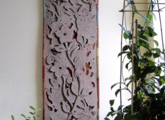 Felt Floral I, wall hanging, industrial wool felt, nylon gauze backing and trim, buttons, beads, bamboo rod, 22" x 65"