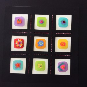 Nine Posies, layered cut papers, beads